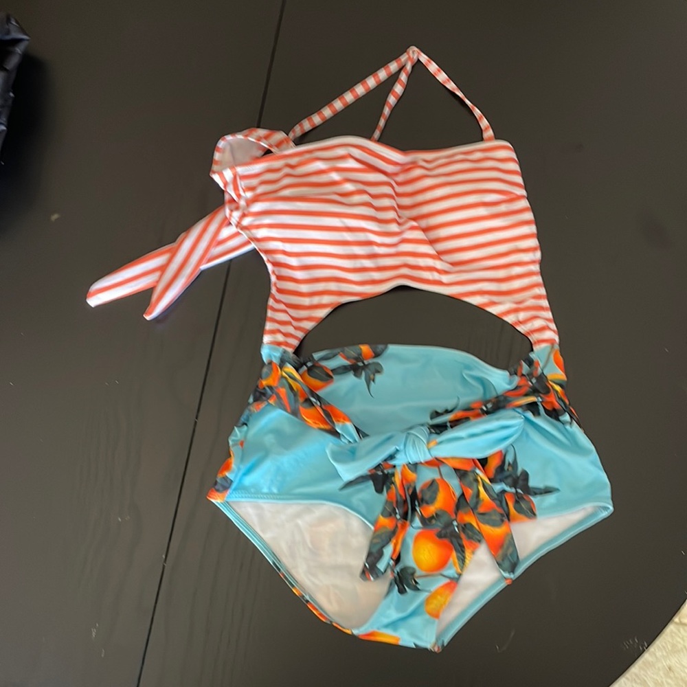 Amazon Find!  Cute bathing that my wife rocks … but has to go.